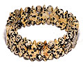 Armband. Bredd cirka 2 cm, längd cirka 16 cm.