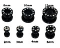 Svart tunnelpiercing 2-12 mm.